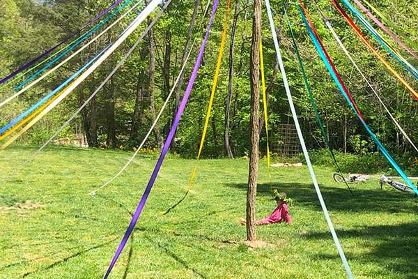 Sitting under May Pole