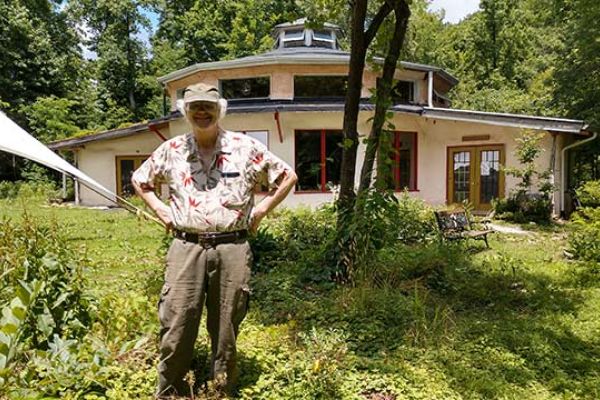 Paul Caron with the Earthaven Council Hall