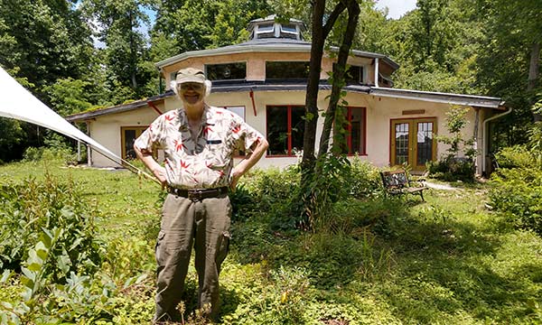 Paul Caron with the Earthaven Council Hall