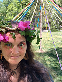 Kaitlin Ilya Wolf in front of the May Pole